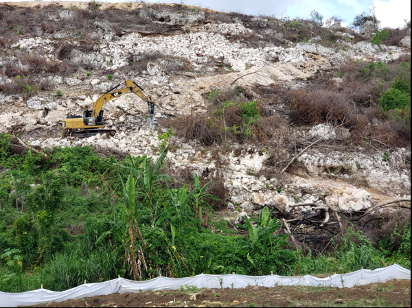Excavator on the hill near Milk River, Clarendon
